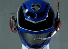 a blue and black helmet with a red arrow on it