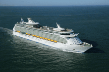 a large cruise ship is floating on the ocean