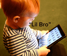 a baby is playing with a tablet with a quote from lil bro