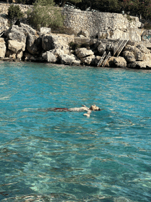 a man is floating on his back in a body of water