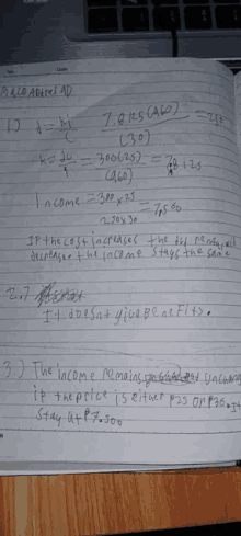 a notebook is open to a page that says ' income = 380 x 23 '