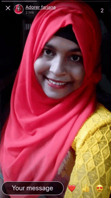 a woman wearing a red hijab and a yellow shirt is smiling and says " your message " on the bottom