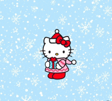 hello kitty is wearing a santa hat and holding a present