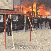 a group of people standing in front of a fire with the words " live look at little " on the bottom