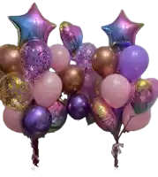 a bunch of pink and purple balloons with a star shaped balloon in the middle