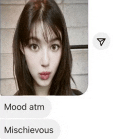 a screenshot of a woman 's face with the words mood atm mischievous below it