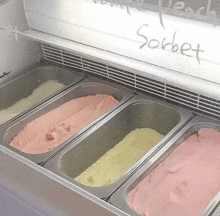 several containers of different flavors of ice cream with the word sorbet written on the side