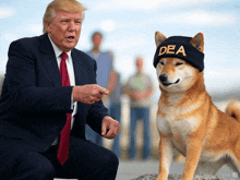 a dog wearing a dea hat sits next to a man in a suit and tie