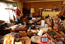 a man standing in a messy living room with a etch a sketch