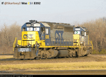 two csx trains are on the tracks and one has n591ua flight 93 on the front of it