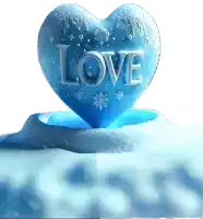 a heart shaped ice sculpture with the word love carved into it