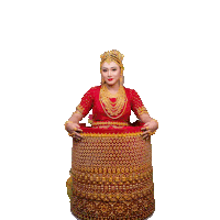 a woman in a red dress and gold jewelry is holding a red and gold skirt