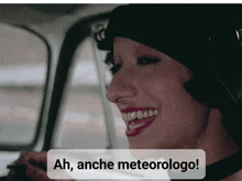 a woman in a car with the words ah anche meteorologo