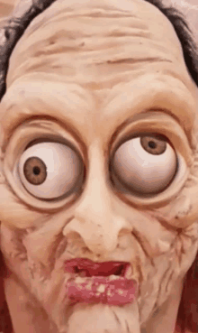 a close up of a person 's face with huge eyes