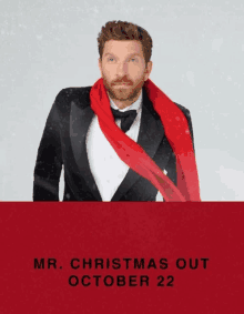 a poster for mr. christmas out shows a man in a tuxedo with a scarf around his neck