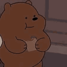 a brown bear from we bare bears is holding a piece of bread in his hands .