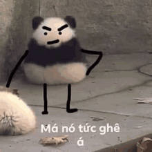 a panda bear is sitting on the ground with a drawing of a panda bear with arms and legs .