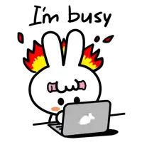 a cartoon of a bunny sitting in front of a laptop with the words i 'm busy written below it