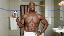 a shirtless man in a bathroom holding a bottle of old spice shampoo