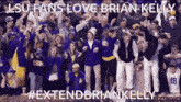 a group of people standing in front of a sign that says extendbriankelly