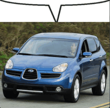 a blue subaru suv is driving down a road