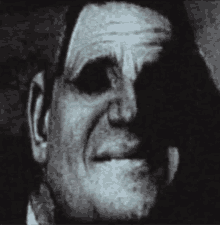 a close up of a man 's face with a shadow on it .