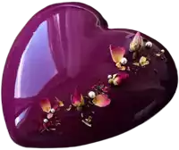 a purple heart shaped object with flowers and pearls on top