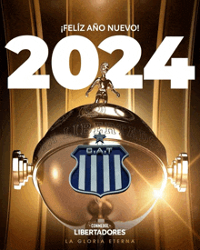 a poster that says feliz ano nuevo 2024 on top of a trophy