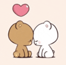 two teddy bears are kissing each other under a heart .