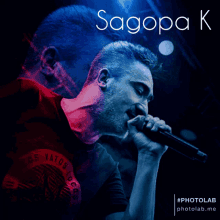 a man singing into a microphone with the name sagopa k