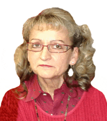 an older woman wearing glasses and a red shirt