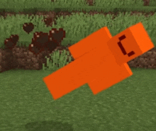 an orange minecraft character is laying on the grass