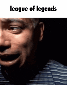 a close up of a man 's face with the words " league of legends " above it