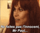 a woman with red hair says " ne faites pas l' innocent "