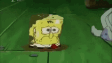 a cartoon character , spongebob squarepants , is standing on a green tiled floor .