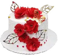 a white cake decorated with red flowers and gold butterflies