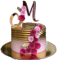 a gold and pink cake with a letter m on top