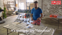 a man is kneeling down in front of a table with the words " it 's going to say fabulous " written on it