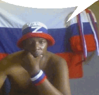 a shirtless man wearing a red white and blue hat with the letter z on it