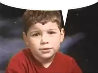 a young boy in a red shirt with a speech bubble above his head .