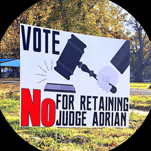 a sign that says " vote for retaining no judge adrian "