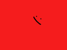 a red background with a smiley face drawn on it