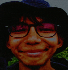 a young man wearing glasses and a hat smiles for the camera