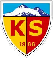 a red and yellow shield with the letters ks and 1966 on it