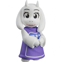 a figurine of a sheep with horns and a purple dress