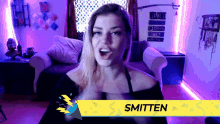 a woman with the name smitten on the bottom of her screen