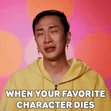 a man in a yellow hoodie is crying with the words " when your favorite character dies " below him