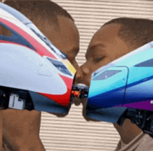 a man and a child kissing with a train on their faces