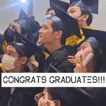 a group of graduates are posing for a picture with congratulations graduates written on the bottom