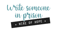 a sign that says " write someone in prison wire of hope "